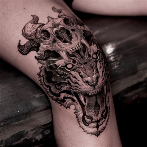 A tattoo of an eye can work well here because of the shape. . Skull on knee tattoo